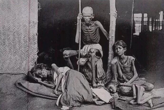 A man guards his family from the cannibals during the Madras famine of 1877 at the time of British Raj, India [976x549]